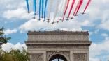 Acrobatic teams create the French flag over Paris