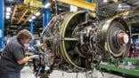 American Airlines technician working on engine