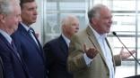 U.S. Sen. Tim Kaine (D-VA) speaks as (L-R) Sen. Chris Van Hollen (D-MD), Sen. Mark Warner (D-VA), and Sen. Ben Cardin (D-MD) listen during a news conference at Ronald Reagan Washington National Airport 