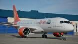 Ibom Air Airbus A220 outside hangar