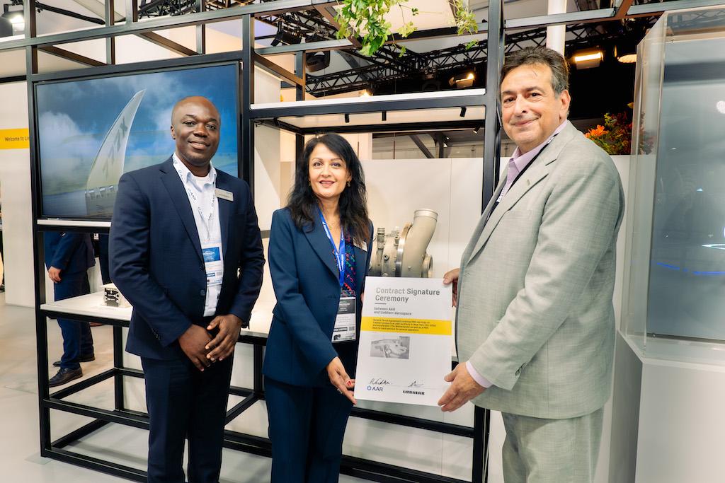 Ravinder Sidhu, director of sourcing (center), Emil Dickson, senior manager business development repair and engineering services for AAR (left) and Liebherr-Aerospace & Transportation SAS chief customer officer Alex Vlielander at the signing ceremony for AAR and Liebherr's accord.