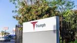 triumph group hq sign